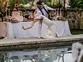 the bride and groom at the swimming pool of the chateau