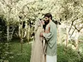 bride and groom in the orchard