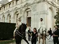 the bride and groom in front of the chateau