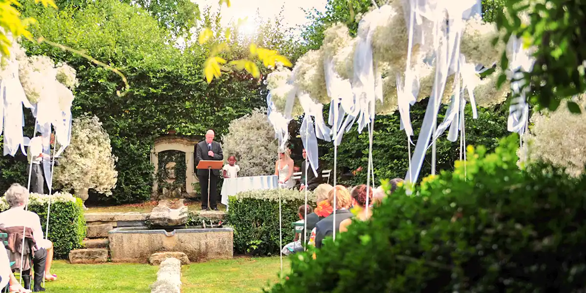 Pastor officiates protestant wedding in the rose garden