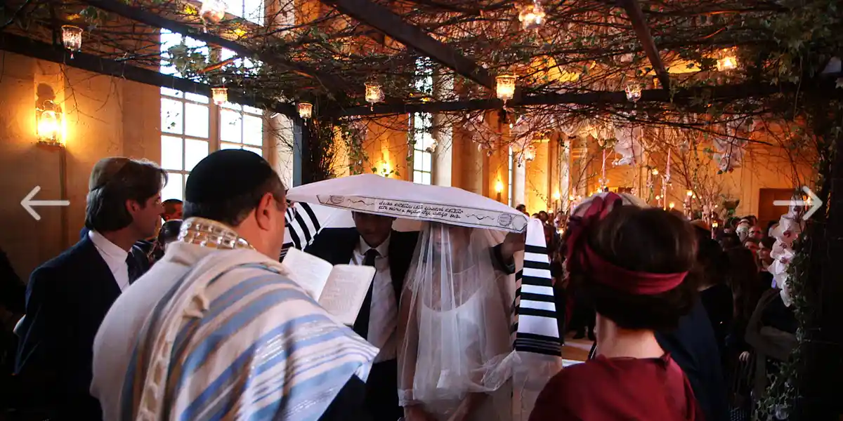 jewish wedding romantic vows in the large room of the chateau