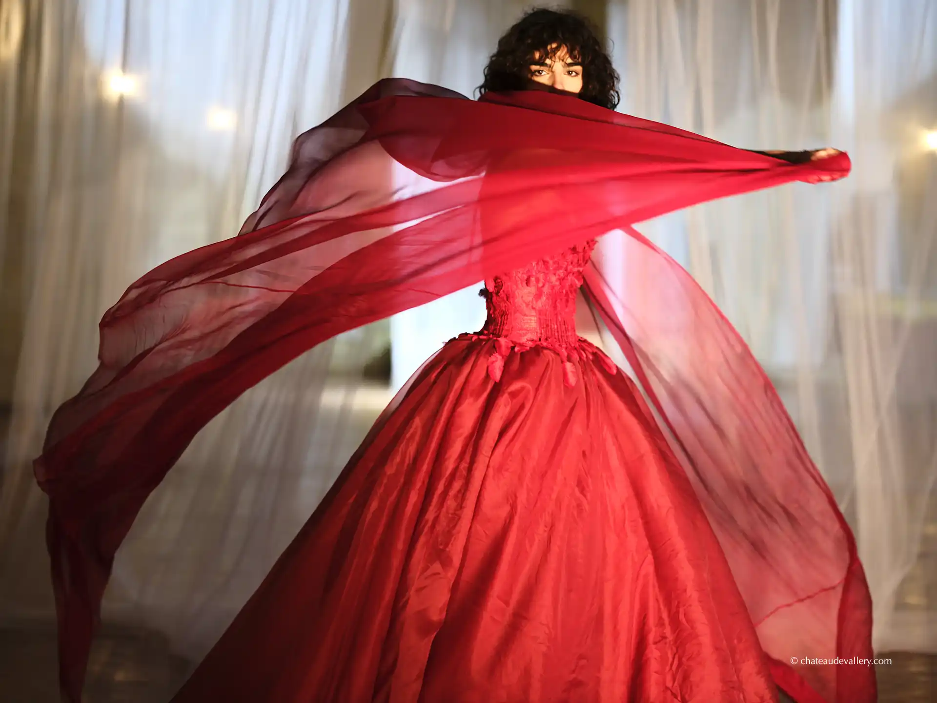 bride wearing red dress in the grande galerie