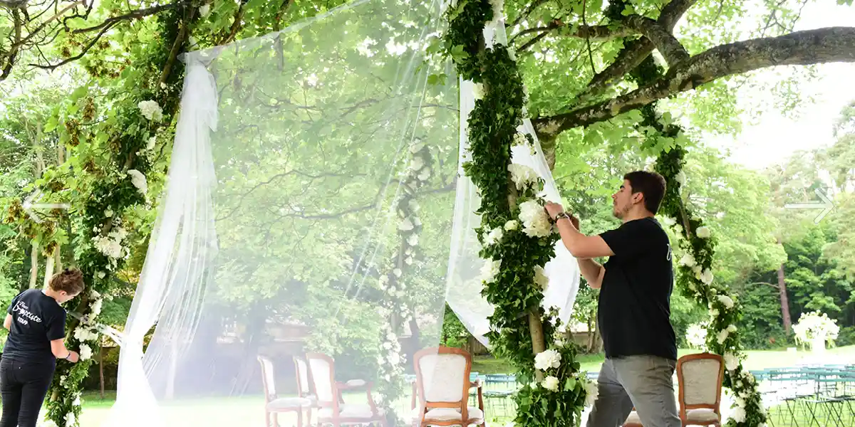 flowering chuppah setting under the sycamore of Château de Vallery